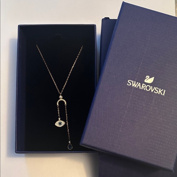 Swarovski Jewelry - Swarovski Rose Gold Evil Eye Lariat Necklace with Blue Crystal
